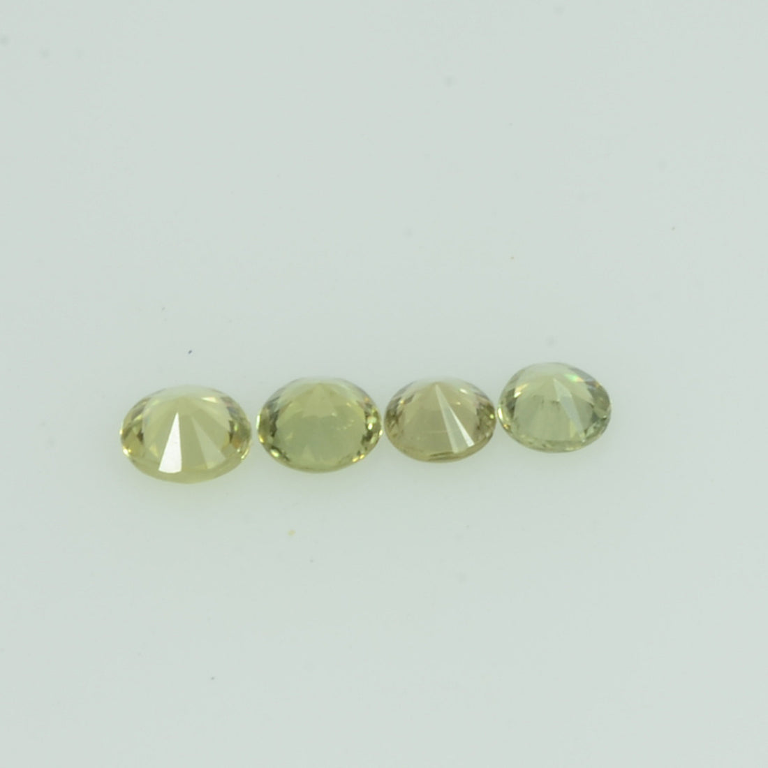 1.4- 3.5 mm Natural Yellowish Green Sapphire Loose Gemstone Round Diamond Cut Color - Thai Gems Export Ltd.